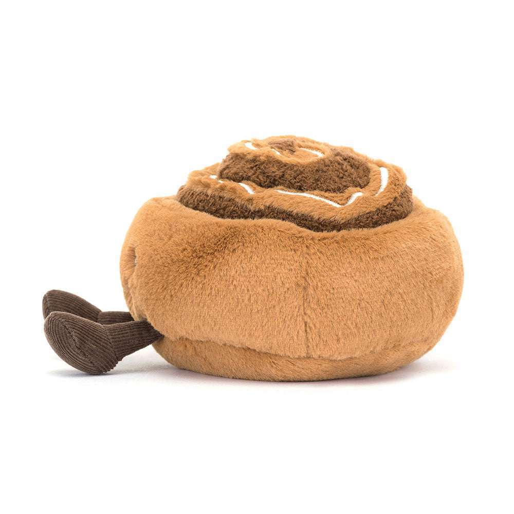 Cuddly Jellycat Amuseables Cinnamon Bun plush toy with a smiling face and soft, textured fabric.