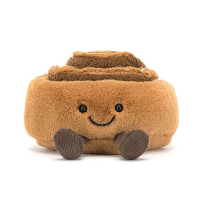 Cute Jellycat Amuseables Cinnamon Bun plush toy with a smiling face and soft, textured details.
