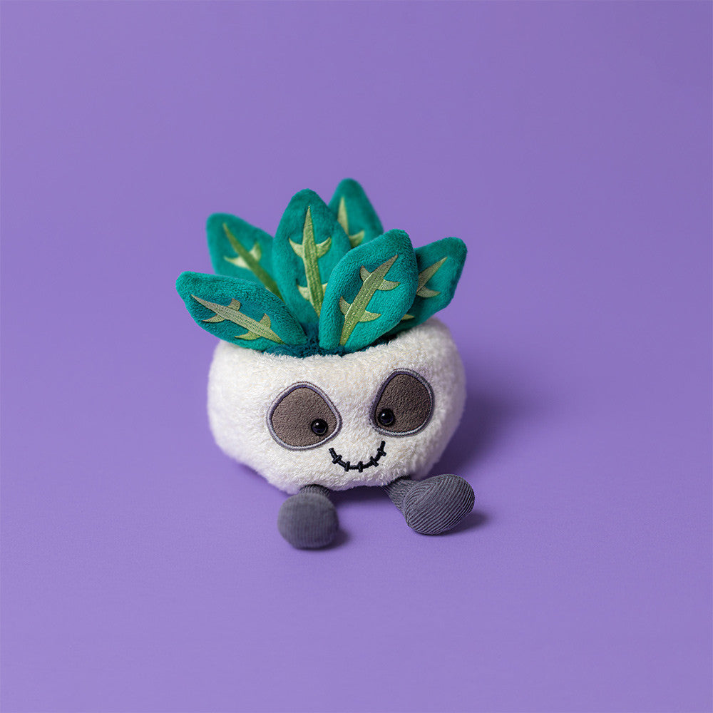 Jellycat Amuseables Skull Planter with a playful, smiling skull design and vibrant plant inside, ideal for quirky home decor.