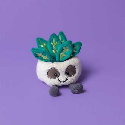 Jellycat Amuseables Skull Planter with a playful, smiling skull design and vibrant plant inside, ideal for quirky home decor.