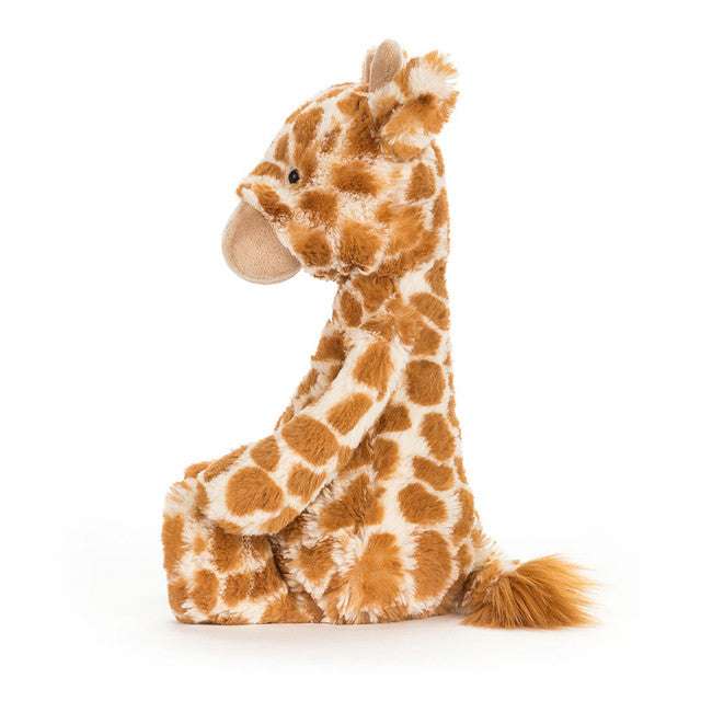 Soft Bashful Giraffe Medium plush toy by Jellycat, featuring a spotted design and floppy limbs for cuddly playtime.