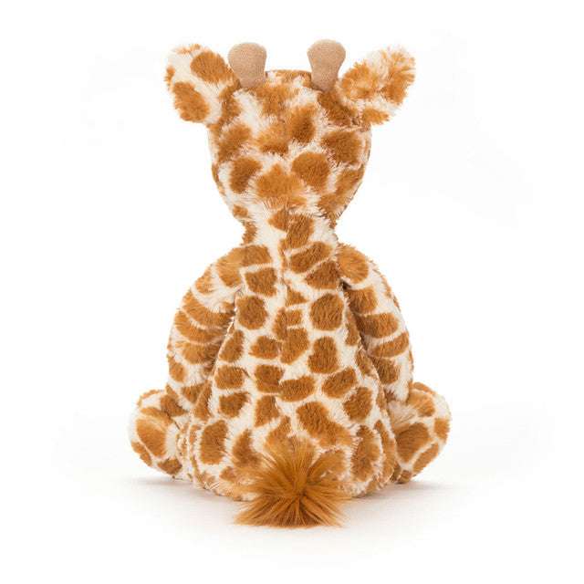 Medium Bashful Giraffe plush toy by Jellycat with soft fur and floppy limbs, perfect for cuddling and playtime.
