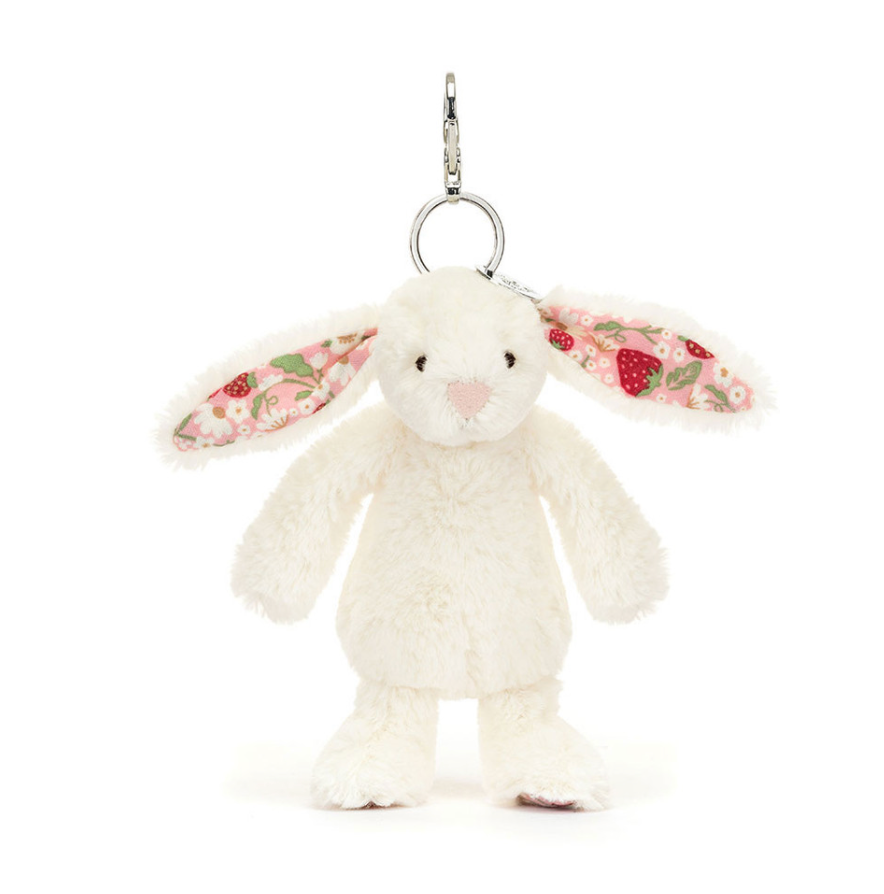 Jellycat Blossom Cream Bunny 'Berry' bag charm featuring a soft cream bunny with pink accents and a playful design.