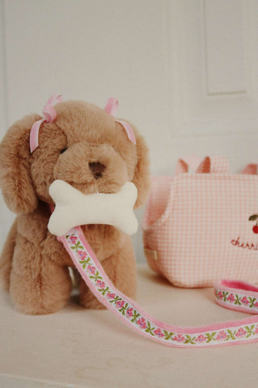 Konges Sløjd Maude Puppy plush toy, soft and cuddly play companion for children, featuring a cute puppy design and gentle fabric.