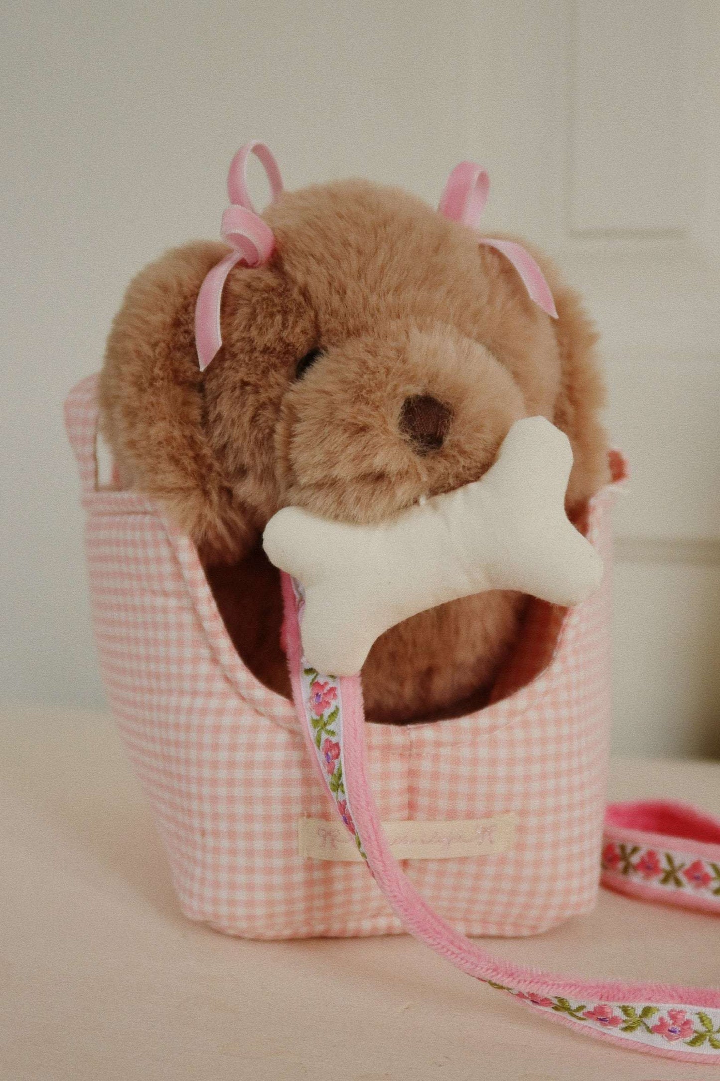 Konges Slojd Maude Puppy plush play toy with soft fabric and adorable design, perfect for children.